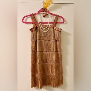 Girls Flapper Costume complete with headband and faux pearls.